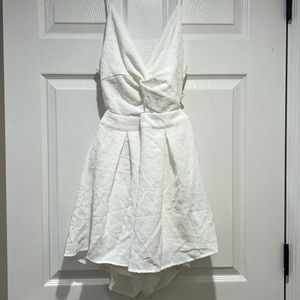 White romper with an adorable bow tie in the back